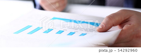 Male clerk arm examine important financial papers Male clerk arm examine important financial papers 54292960