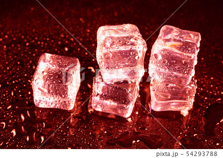 ice cubes on a reflections red light. ice cubes on a reflections red light. 54293788