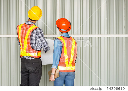 behind of two engineer inspected constructio 54296610