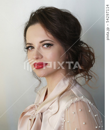 Girl with a haircut and make-up. Brunette Girl with a haircut and make-up. Brunette 54297114