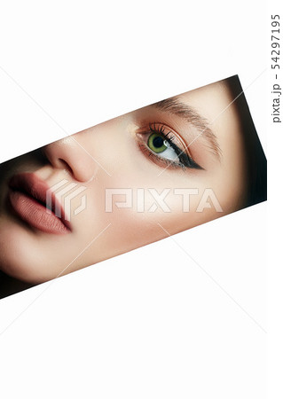 beautiful woman with makeup into paper hole 54297195