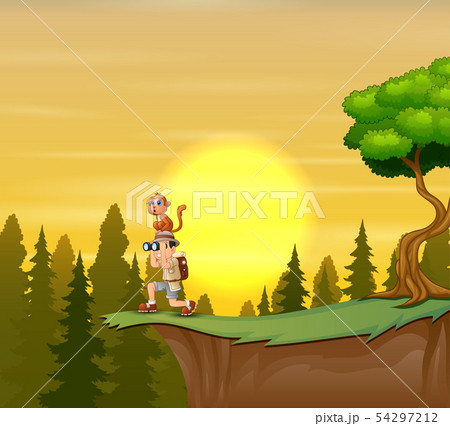 Boy standing on top of the mountain cliff Boy standing on top of the mountain cliff 54297212