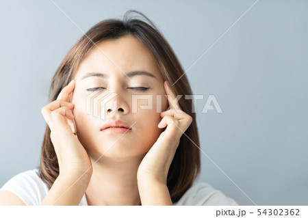 Closeup woman headache and depressed with grey 54302362