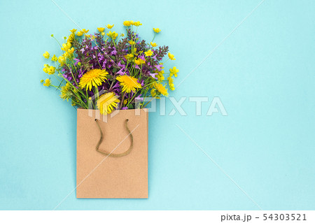 Field colorful rustic flowers in craft package on 54303521