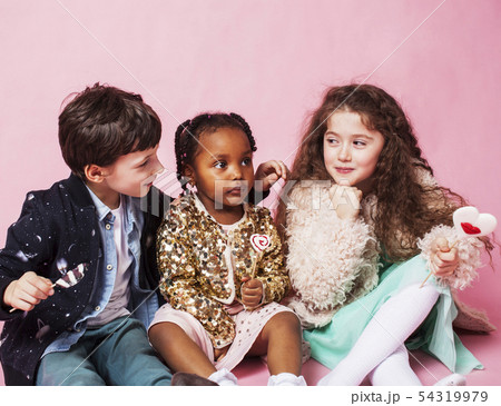 lifestyle people concept: diverse nation children playing together, caucasian boy with african lifestyle people concept: diverse nation children playing together, caucasian boy with african 54319979