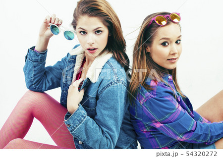 two best friends teenage girls together having fun, posing emotional on white background, besties two best friends teenage girls together having fun, posing emotional on white background, besties 54320272