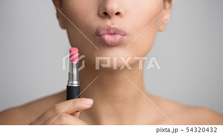 Lady Holding Pink Lipstick and Sending Air Kiss Lady Holding Pink Lipstick and Sending Air Kiss 54320432