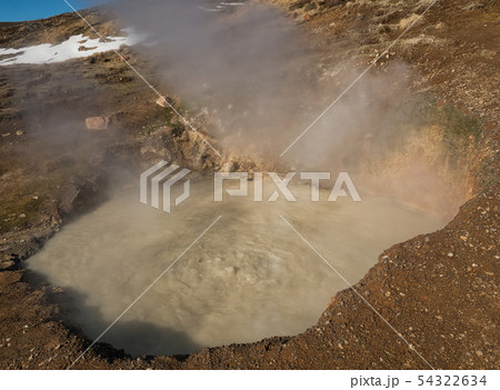 Steaming and boiling mud basin in Iceland Steaming and boiling mud basin in Iceland 54322634