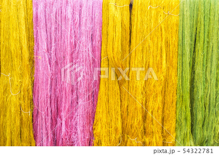 Thai silk threads fiber background in pink, green Thai silk threads fiber background in pink, green 54322781