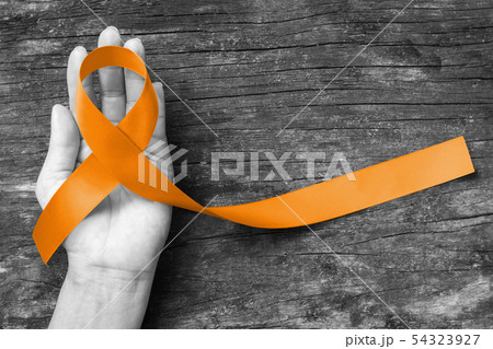 Amber color ribbon for raising awareness campaign  54323927