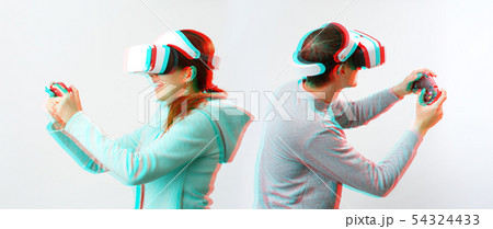 Man and woman with virtual reality headset are playing game. Image with glitch effect. 54324433