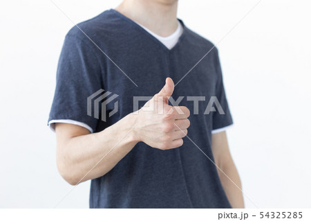 Gesture and people concept - Close up of male showing thumb up on white background with copy space Gesture and people concept - Close up of male showing thumb up on white background with copy space 54325285