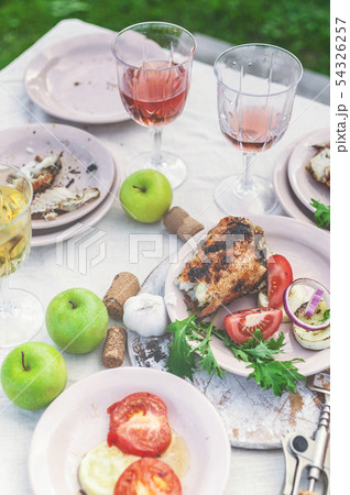 Glasses of white and rose wine, grilled fish Glasses of white and rose wine, grilled fish 54326257