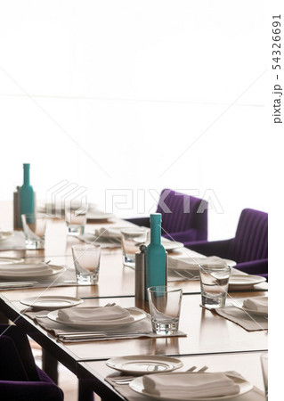 Chairs and table ready for serving meal Chairs and table ready for serving meal 54326691