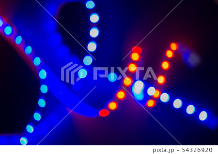 Red and blue blurry neon spirals of bokeh lights 54326920