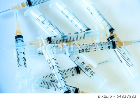 Syringes on blue background Syringes on blue background 54327832