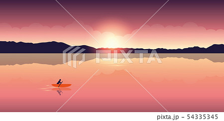 lonely canoeing adventure with orange boat at sunrise on the lake 54335345