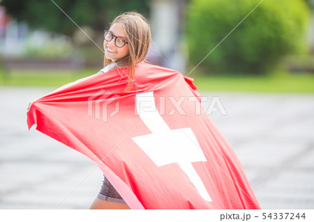 Happy girl tourist walking in the street with 54337244