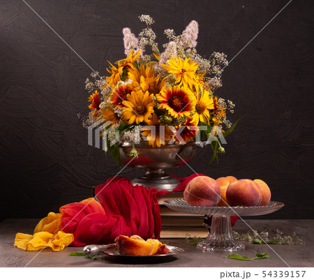 Still life with bright summer flowers on a dark Still life with bright summer flowers on a dark 54339157