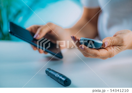 Blood Sugar Testing with Portable Glucometer Blood Sugar Testing with Portable Glucometer 54341210