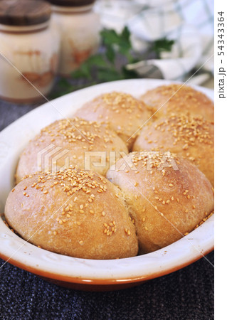 Fresh homemade sourdough bread buns with sesame Fresh homemade sourdough bread buns with sesame 54343364