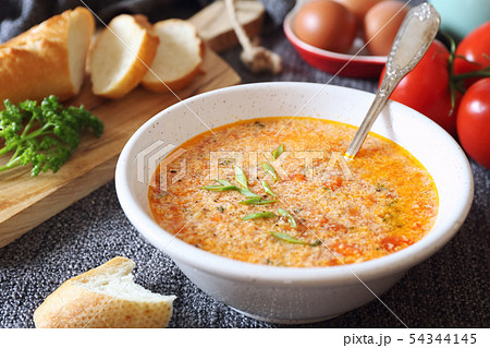Italian tomato soup Stracciatella with parsley Italian tomato soup Stracciatella with parsley 54344145