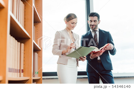 Turkish and central European lawyer in their law firm working 54346140