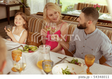 Beautiful blonde-haired woman looking at her handsome husband Beautiful blonde-haired woman looking at her handsome husband 54348011