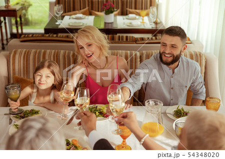 Girl celebrating wedding of grandmother with parents Girl celebrating wedding of grandmother with parents 54348020
