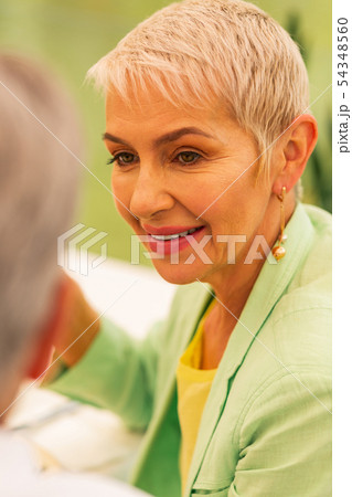 Woman wearing nice earrings looking at husband 54348560