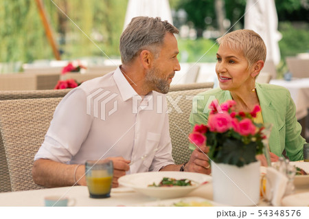 Loving grey-haired mature man looking at his beautiful wife Loving grey-haired mature man looking at his beautiful wife 54348576