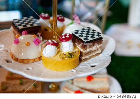 Magical and colorful set of afternoon tea  54348872