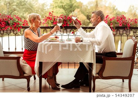 Couple of mature husband and wife celebrating their anniversary Couple of mature husband and wife celebrating their anniversary 54349207