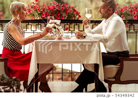 Couple of businessmen enjoying romantic dinner outside Couple of businessmen enjoying romantic dinner outside 54349342