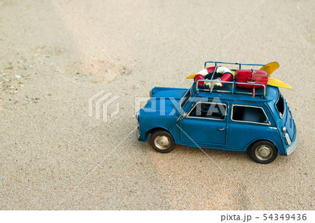 Blue toy car drive on the beach, sand 54349436