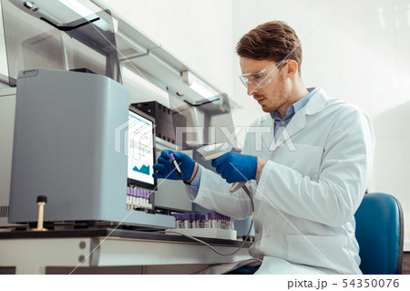 Smart bearded man holding a professional scanner 54350076
