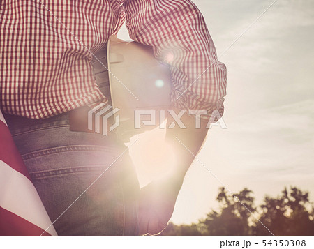Young engineer, white hardhat and American Flag Young engineer, white hardhat and American Flag 54350308