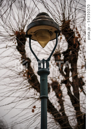 Old rusty lantern and gloomy sky Old rusty lantern and gloomy sky 54350370