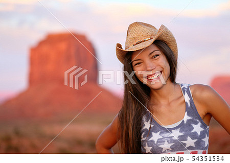 Cowgirl woman happy portrait in Monument Valley 54351534