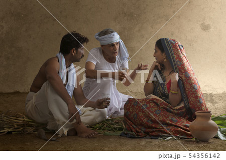 Two farmer talking with rural woman 54356142