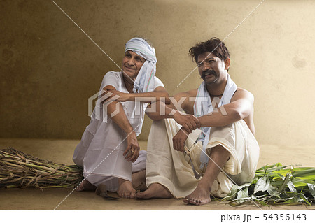 Two Indian farmer sitting together 54356143
