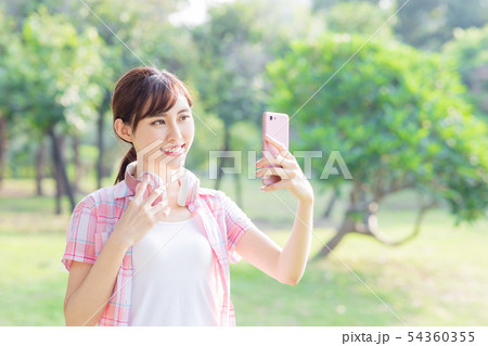 young asian woman take selfie 54360355
