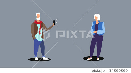 senior man using smartphone camera taking photo of aged mature woman model fashion shoot concept 54360360