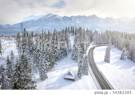 Winter. Snowy mountains and wooden house. 54362205