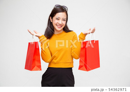 Portrait of a happy woman holding shopping bag Portrait of a happy woman holding shopping bag 54362971