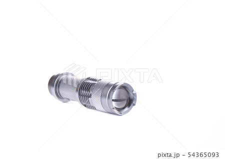 Pocket flashlight in a metal case on white Pocket flashlight in a metal case on white 54365093
