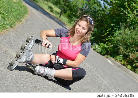 young woman fell on skates 54366288