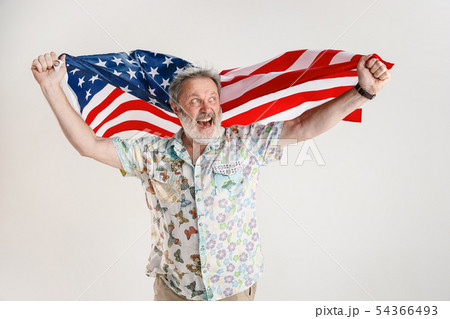 Senior man with the flag of United States of America Senior man with the flag of United States of America 54366493