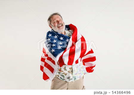 Senior man with the flag of United States of America Senior man with the flag of United States of America 54366496