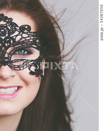 Mysterious woman wearing lace mask 54367056